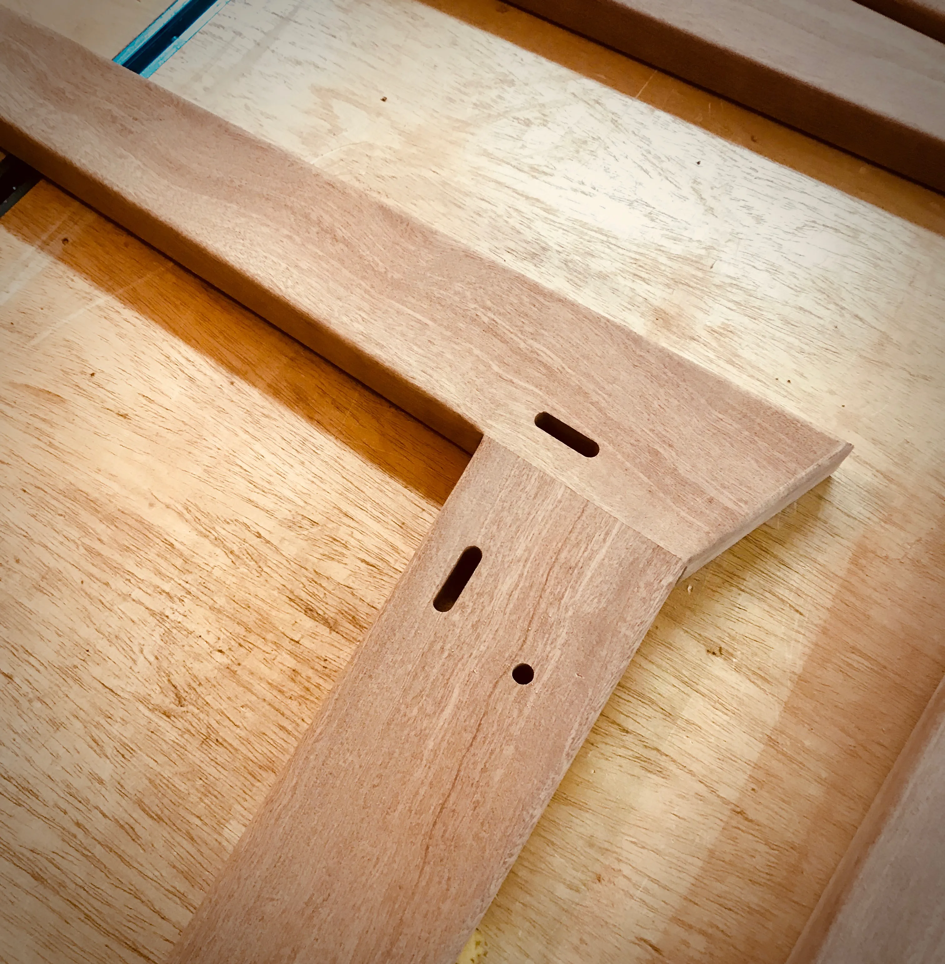 Mahogany boards being milled and measured on the workbench for the chair