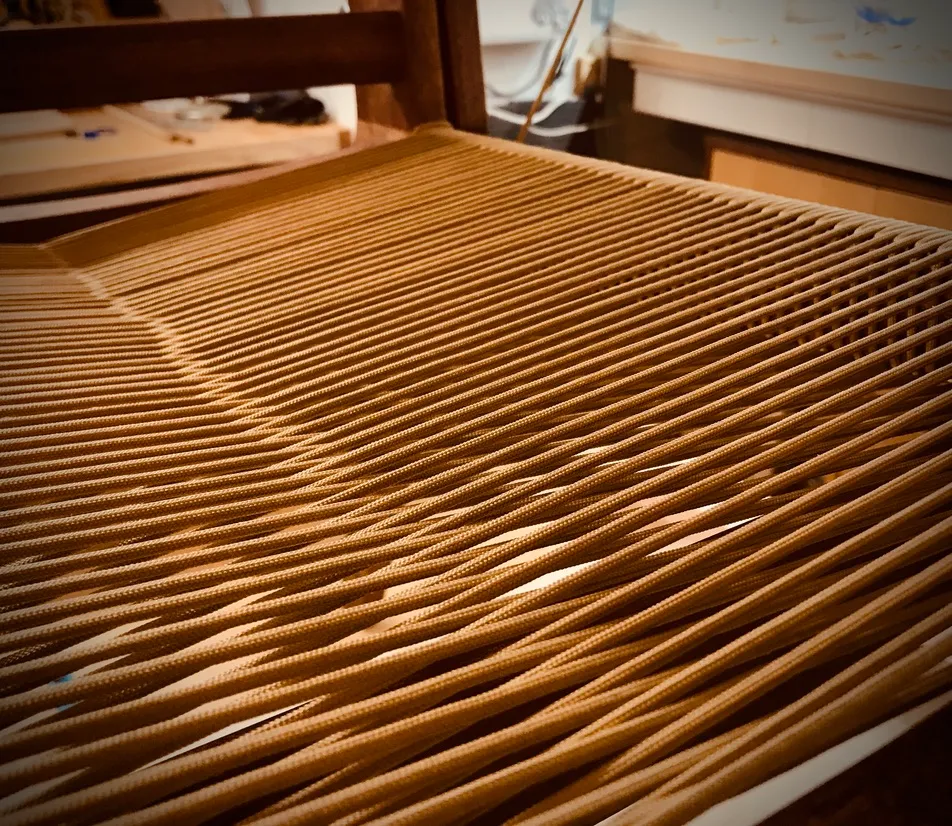 Modern mahogany lounge chair shown from a wider angle