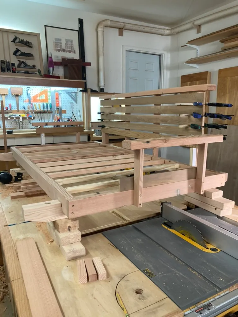 Cutting the porch swing's reclaimed wood slats to length