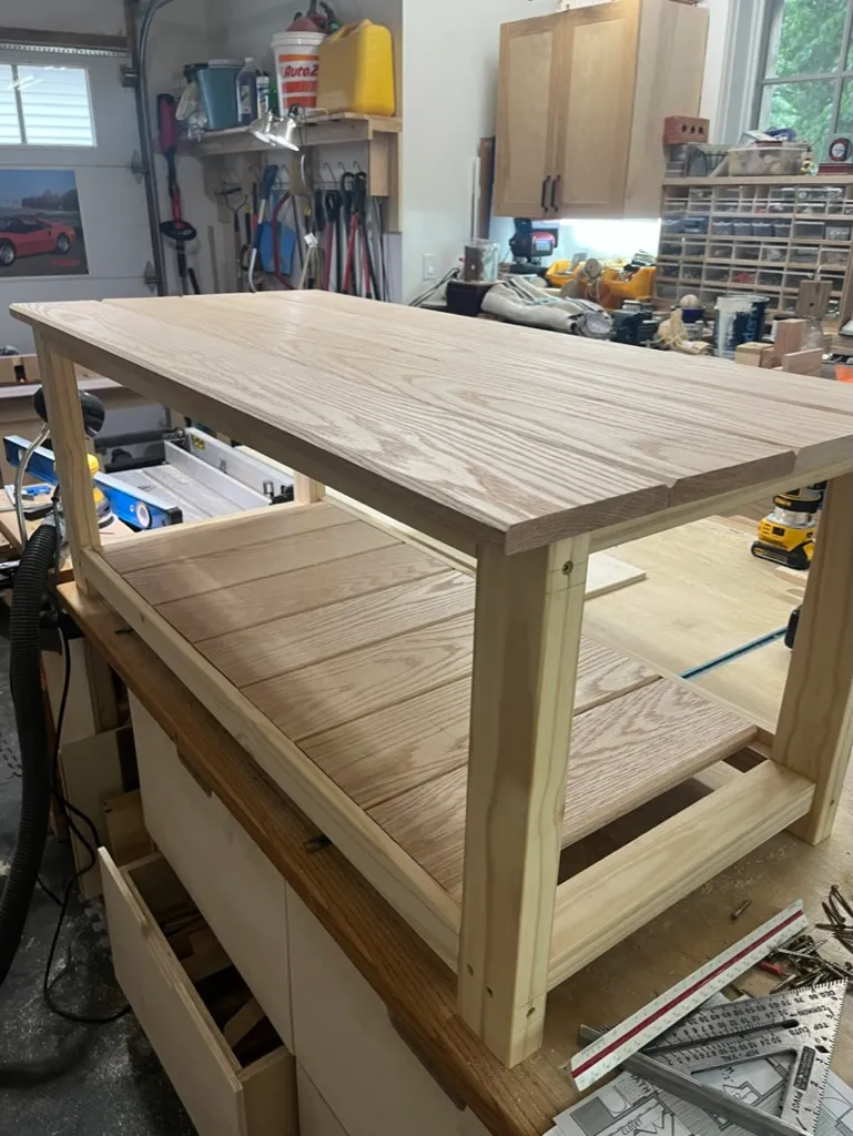 Sanding the coffee table's oak tabletop boards