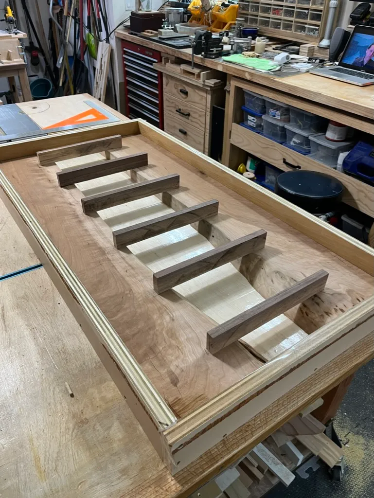 Fitting the walnut connectors into the cherry slabs before the epoxy pour