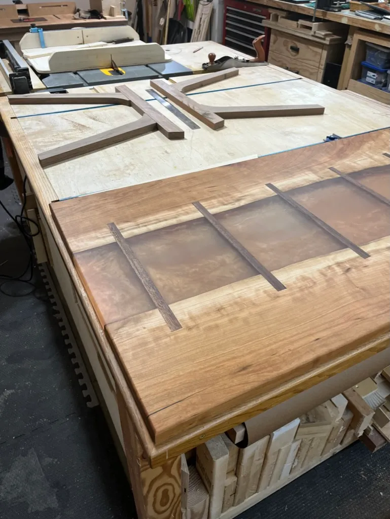 Sanding the river table's epoxy surface