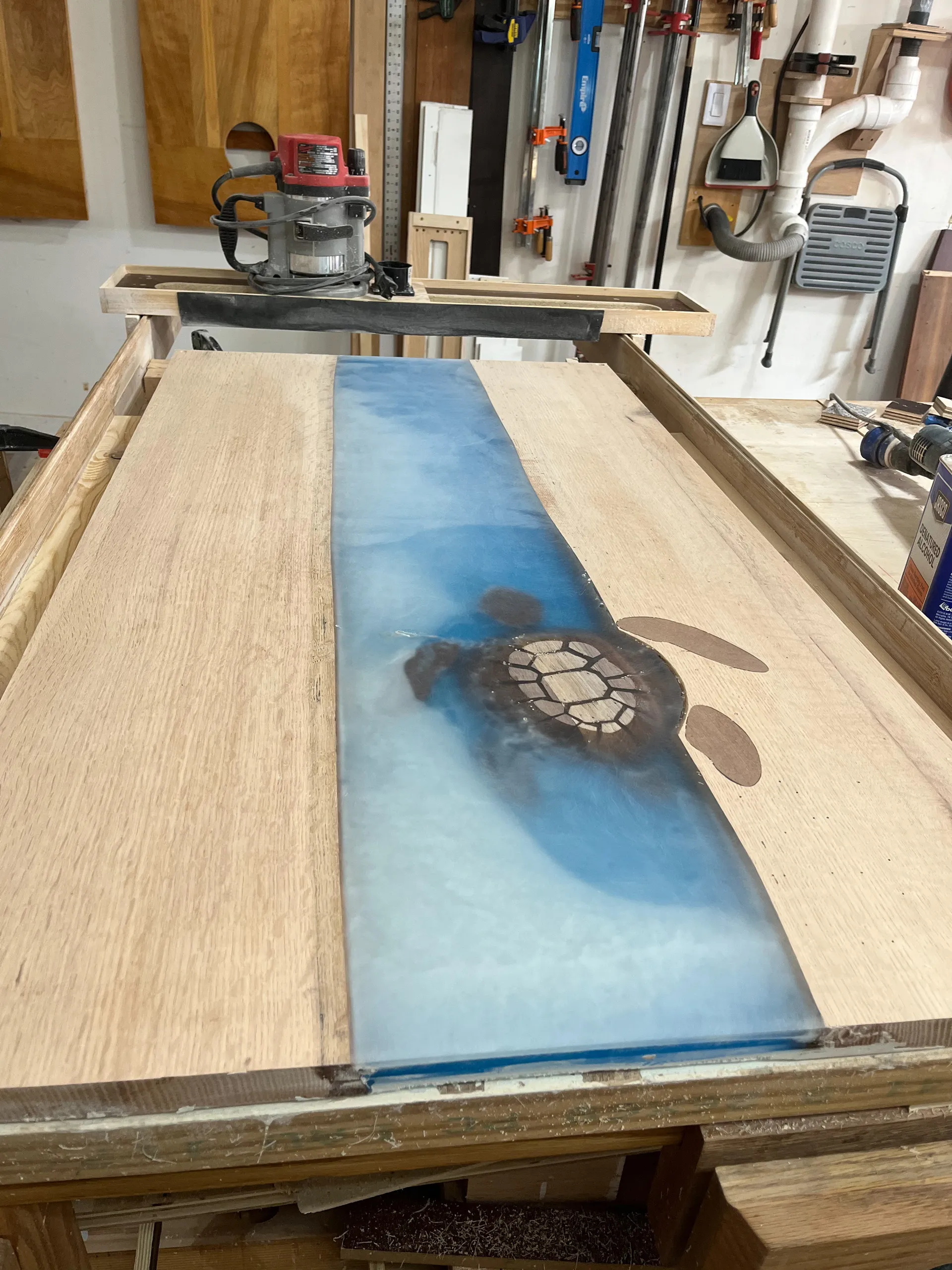 Sanding the turtle table's epoxy surface