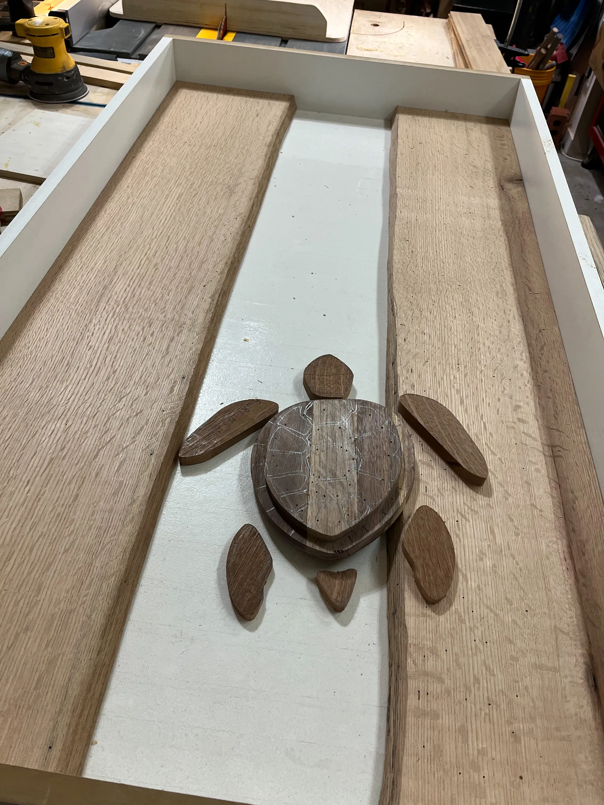 Live edge white oak slabs laid out for the turtle table's river design