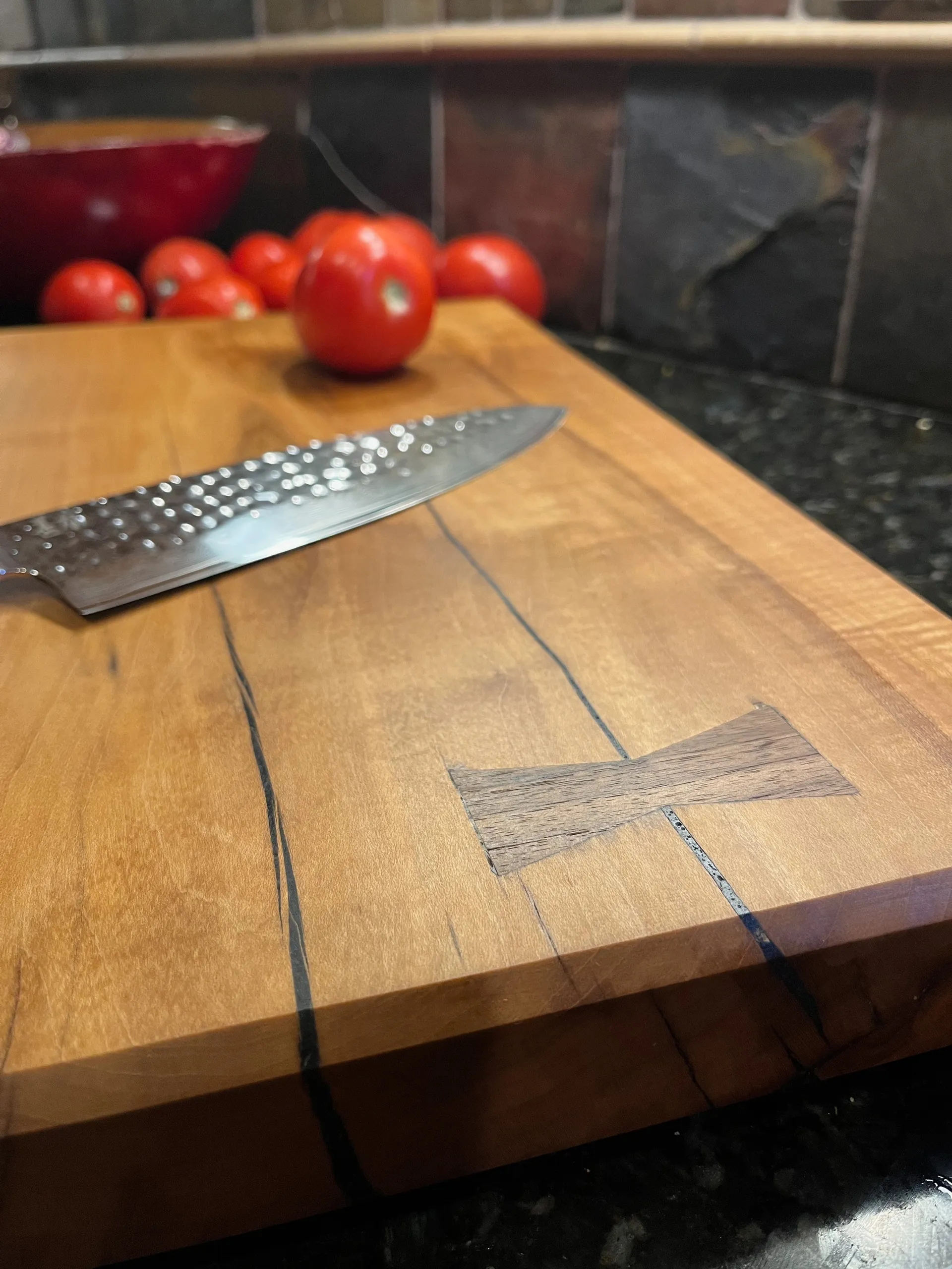 Close-up of the cutting board's live edge and grain