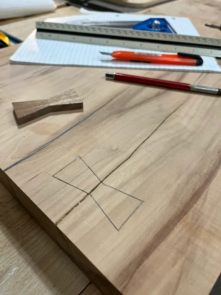 Bowtie inlay pattern marked and cut into the cutting board's surface with a utility knife and ruler