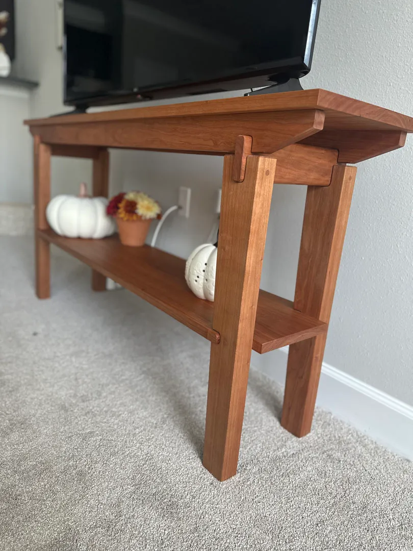 Cherry end table viewed from the back corner