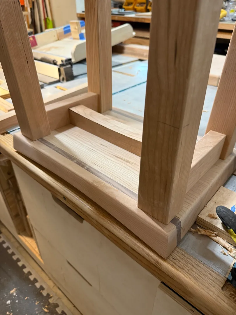 Checking the stool's saddle seat fit